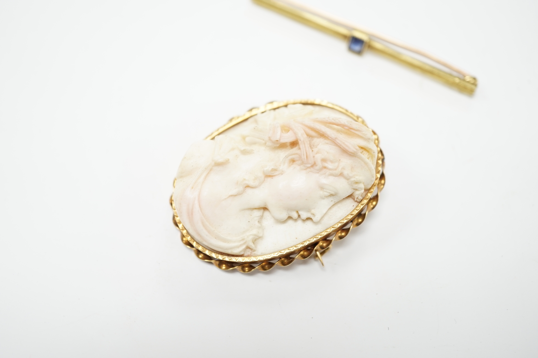 A yellow metal mounted composition cameo set oval brooch, 46mm, together with a yellow metal and gem set bar brooch.